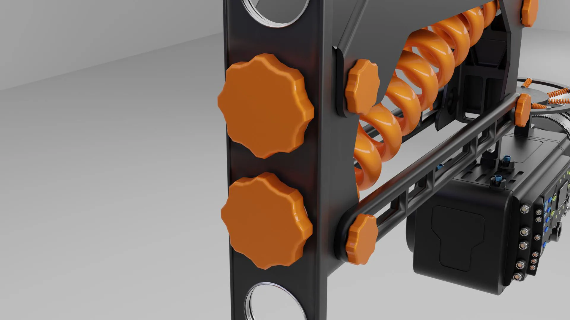 Close-up of the orange screw knobs and spring